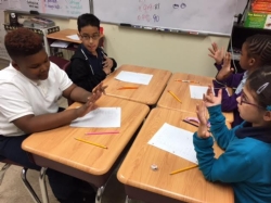 3rd Grade learns new technique for solving for 9's